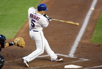 NEW YORK - AUGUST 22:  David Wright #5 of the New York Mets hits an RBI single in the first inning against the Houston Astros on August 22, 2008 at Shea Stadium in the Flushing neighborhood of the Queens borough of New York City.  (Photo by Jim McIsaac/Ge