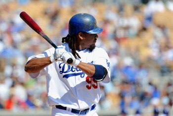 GLENDALE, AZ - MARCH 13:   Manny Ramirez #99 of the Los Angeles Dodgers at bat during a Spring Training game against the Texas Rangers on March 13, 2009 at Camelback Ranch in Glendale, Arizona.  (Photo by Lisa Blumenfeld/Getty Images)