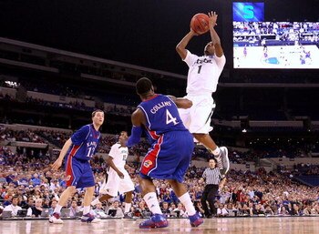 INDIANAPOLIS - MARCH 27:  Kalin Lucas #1 of the Michigan State Spartans drives for a shot attempt against Sherron Collins #4 of the Kansas Jayhawks during the third round of the NCAA Division I Men's Basketball Tournament at the Lucas Oil Stadium on March