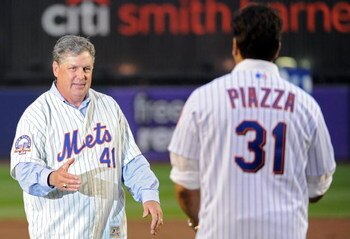 NEW YORK - SEPTEMBER 28:  Former Mets Tom Seaver #41 and Mike Piazza #31 wave goodby to Shea fans from the field in a post game ceremony after the last regular season baseball game ever played in Shea Stadium against the Florida Marlins on September 28, 2