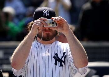 NEW YORK - APRIL 02:  A fan takes a picture during a New York Yankees workout at the new Yankee Stadium on April 2, 2009 in the Bronx borough of New York City.  (Photo by Ezra Shaw/Getty Images)