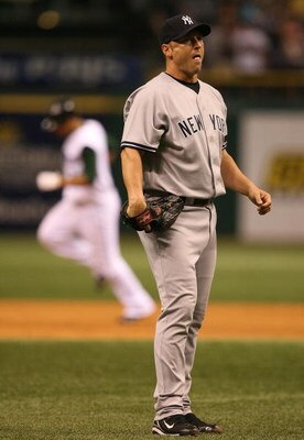 ST. PETERSBURG, FL - JULY 15:  Relief pitcher Ron Villone #47 of the New York Yankees reacts on the mound as Carlos Pena #23 of the Tampa Bay Devil Rays rounds the bases after hitting a two-run home-run in the seventh inning on July 15, 2007 at Tropicana 