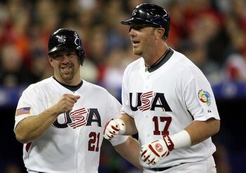 TORONTO, ON - MARCH 07:  Kevin Youkilis #21 of the USA congratulates teammate Adam Dunn #17 after Dunn hit a two run homer to drive home Youkilis against Canada during the 2009 World Baseball Classic Pool C match on March 7, 2009 at the Rogers Center in T