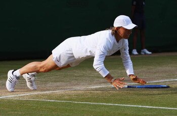 LONDON - JULY 06:  Martina Navratilova of United States does press-ups playing with Helena Sukova of Czech Republic during the ladies invitational doubles Final against Kathy Rinaldi of United States and Jana Novotna of Czech Republic and  on day thirteen