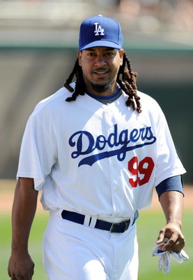 GLENDALE, AZ - MARCH 13:   Manny Ramirez #99 of the Los Angeles Dodgers walks along the field before a Spring Training game against the Texas Rangers on March 13, 2009 at Camelback Ranch in Glendale, Arizona.  (Photo by Lisa Blumenfeld/Getty Images)