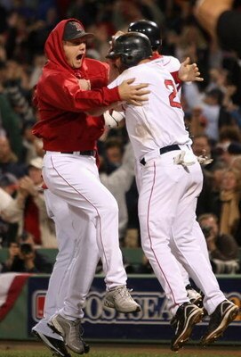 BOSTON - OCTOBER 16:  Relief pitcher Jonathan Papelbon #58 of the Boston Red Sox celebrates with Kevin Youkilis #20 after defeating the Tampa Bay Rays in game five of the American League Championship Series during the 2008 MLB playoffs at Fenway Park on O
