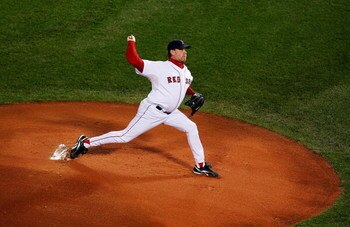 BOSTON - OCTOBER 20:  Starting pitcher Curt Schilling #38 of the Boston Red Sox deals against the Cleveland Indians during Game Six of the American League Championship Series at Fenway Park on October 20, 2007 in Boston, Massachusetts.  (Photo by Jim Roga