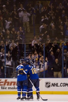 ST. LOUIS, MO. - MARCH 12: The St. Louis Blues celebrate an empty-net goal against the San Jose Sharks at the Scottrade Center on March 12, 2009 in St. Louis, Missouri.  (Dilip Vishwanat/Getty Images)