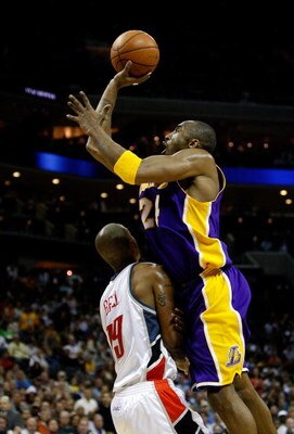 CHARLOTTE, NC - MARCH 31:  Kobe Bryant #24 of the Los Angeles Lakers shoots over Raja Bell #19 of the Charlotte Bobcats during their game at Time Warner Cable Arena on March 31, 2009 in Charlotte, North Carolina.  NOTE TO USER: User expressly acknowledges