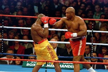 5 Nov 1995:  George Foreman trows a left punch at Michael Moorer during the fight in Las Vegas. Forman wins by a knock out in round 10. Mandatory Credit: Al Bello  /Allsport