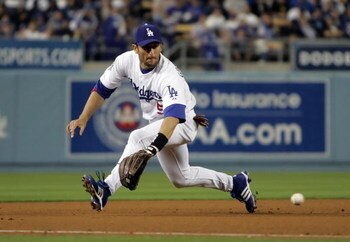 LOS ANGELES, CA - APRIL 16:  Third baseman Nomar Garciaparra #5 of the Los Angeles Dodgers lunges to field a ground ball by Brian Bixler of the Pittsburgh Pirates in the seventh inning at Dodger Stadium on April 16, 2008 in Los Angeles, California.  (Phot
