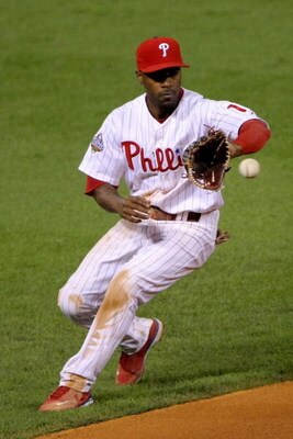 PHILADELPHIA - OCTOBER 26:  Jimmy Rollins #11 of the Philadelphia Phillies fields a ball against the Tampa Bay Rays during game four of the 2008 MLB World Series on October 26, 2008 at Citizens Bank Park in Philadelphia, Pennsylvania.  (Photo by Doug Pens