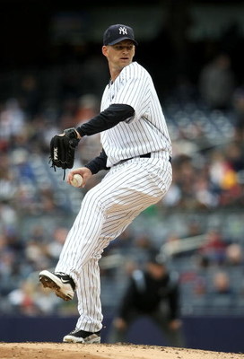 NEW YORK - APRIL 04:  A.J. Burnett #34 of the New York Yankees pitches against the Chicago Cubs during their game on April 4, 2009 at Yankee Stadium in the Bronx borough of New York City.  (Photo by Nick Laham/Getty Images)