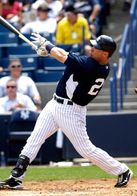 TAMPA, FL - APRIL 01:  Infielder Mark Teixeira #25 of the New York Yankees homers against the Philadelphia Phillies at George Steinbrenner Field April 1, 2009 in Tampa, Florida.  (Photo by Al Messerschmidt/Getty Images)