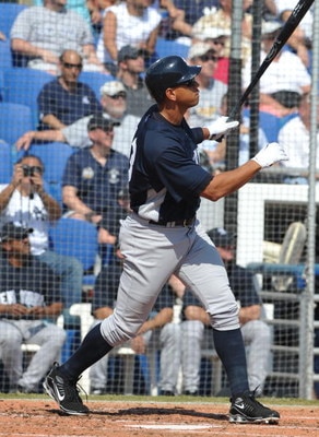 DUNEDIN, FL - FEBRUARY 25 :  Infielder Alex Rodriguez of the New York Yankees hits a two-run home run against the Toronto Blue Jays February 25, 2009 at Dunedin Stadium in Dunedin, Florida.  (Photo by Al Messerschmidt/Getty Images)