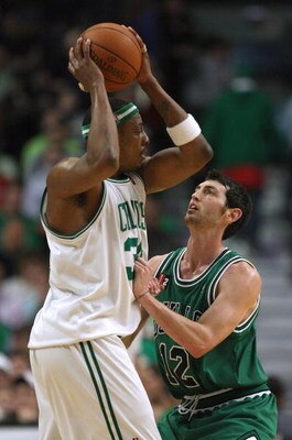 CHICAGO - MARCH 17: Kirk Hinrich #12 of the Chicago Bulls tries to defend against Paul Pierce #34 of the Boston Celtics on March 17, 2009 at the United Center in Chicago, Illinois. The Bulls defeated the Celtics 127-121. NOTE TO USER: User expressly ackno