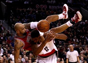 PORTLAND, OR - NOVEMBER 19:  Drew Gooden #90 of the Chicago Bulls falls over the top of LaMarcus Aldridge #12 of the Portland Trail Blazers  at the Rose Garden November 18, 2008 in Portland, Oregon.  NOTE TO USER: User expressly acknowledges and agrees th
