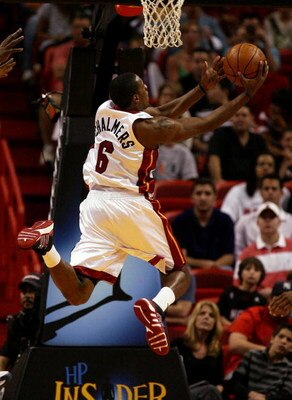MIAMI - DECEMBER 30:  Mario Chalmers #6 of the Miami Heat drives against the Cleveland Cavaliers at American Airlines Arena on December 30, 2008 in Miami, Florida. NOTE TO USER: User expressly acknowledges and agrees that, by downloading and/or using this