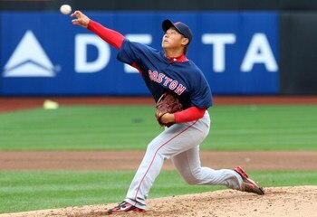 NEW YORK - APRIL 04:  Daisuke Matsuzaka #18 of the Boston Red Sox throws a pitch against the New York Mets on April 4, 2009 at Citi Field in the Flushing neighborhood of the Queens borough of New York City.  (Photo by Jim McIsaac/Getty Images)