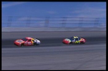 Ricky Rudd #10 and Jeff Gordon #24 compete during the NASCAR Mountain Dew Southern 500 at Darlington Raceway in Darlington, South Carolina.