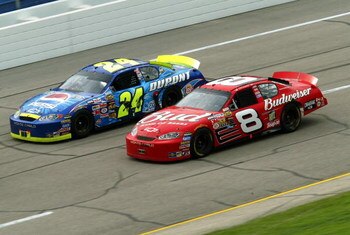 TALLADEGA, AL - APRIL 25:   Jeff Gordon, driver of the #24 Hendrick Motorsports Chevrolet, races alongside Dale Earnhardt, Jr., driver of the #8 Budweiser Chevrolet, in the final laps of the Aaron's 499 on April 25, 2004 at the Talladega SuperSpeedway in 