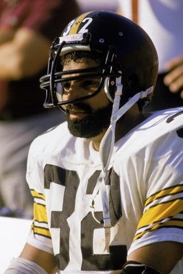 1983:  Franco Harris #32 of the Pittsburgh Steelers sits on the sideline during a 1983 NFL season game.  (Photo by Rick Stewart/Getty Images)