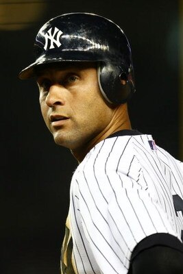 NEW YORK - APRIL 03: Derek Jeter #2 of the New York Yankees watches on against the Chicago Cubs during their game on April 3, 2009 at Yankee Stadium in the Bronx borough of New York City. The exhibition game is the first game to be played at the New Yanke