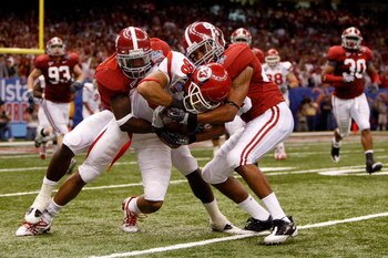 NEW ORLEANS - JANUARY 02:  Wide receiver Freddie Brown #88 of the Utah Utes fights for more yards after the catch as both Marquis Johnson #24 and Rashad Johnson #49 of the Alabama Crimson Tide attempt to tackle him in the fourth quarter during the 75th Al