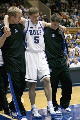 DURHAM, NC - NOVEMBER 25: Martynas Pocius #5 of the Duke Blue Devils is helped off court during the game against the Eastern Kentucky Colonels at Cameron Indoor Stadium on November 25, 2007 in Durham, North Carolina. Duke defeated Eastern Kentucky 78-43. 