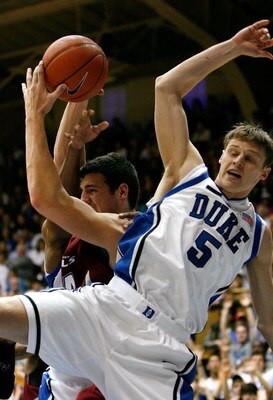 DURHAM, NC - NOVEMBER 25:  Josh Taylor #24 of the Eastern Kentucky Colonels grabs a rebound against Martynas Pocius #5 of the Duke Blue Devils during the first half at Cameron Indoor Stadium on November 25, 2007 in Durham, North Carolina.  Duke defeated E