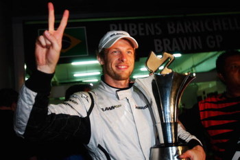 KUALA LUMPUR, MALAYSIA - APRIL 05:  Jenson Button of Great Britain and Brawn GP celebrates in the paddock after winning the rain curtailed Malaysian Formula One Grand Prix at the Sepang Circuit on April 5, 2009 in Kuala Lumpur, Malaysia.  (Photo by Mark T