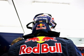 VALENCIA, SPAIN - FEBRUARY 26:  Sebastian Vettel of Germany and Red Bull gets ready in the team garage during Formula One winter testing at the Ricardo Tormo circuit on February 26, 2009 in Valencia, Spain.  (Photo by Paul Gilham/Getty Images)