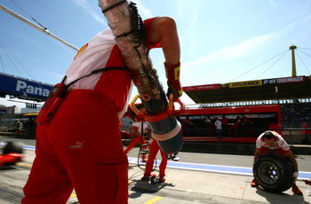 NURBURG, GERMANY - JULY 21:  Ferrari mechanics get ready to practice refuelling Felipe Massa of Brazil and Ferrari during practice prior to qualifying for the European Grand Prix at Nurburgring on July 21, 2007 in Nurburg, Germany.  (Photo by Paul Gilham/