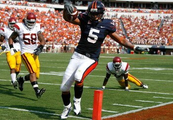 CHARLOTTESVILLE, VA - AUGUST 30:  Tailback Mikell Simpson #5 of the Virginia Cavaliers scores a touchdown against the Southern California Trojans during the game at Scott Stadium on August 30, 2008 in Charlottesville, Virginia.  (Photo by Kevin C. Cox/Get