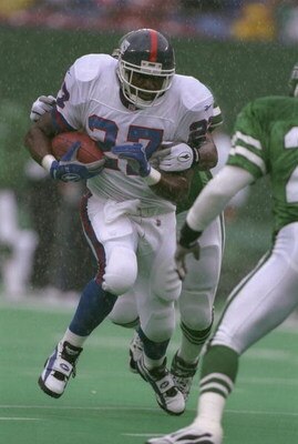 22 Sep 1996:  Running back Rodney Hampton #27 of the New York Giants looks up field as he attempts to run through the grasp of a pursuing defender from the New York Jets during a carry in the Giants 13-6 victory over the Jets at Giants Stadium in East Rut