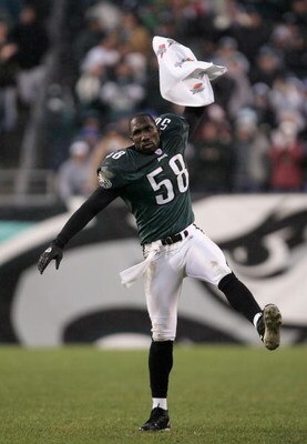 PHILADELPHIA - DECEMBER 19:  Ike Reese #58 of the Philadelphia Eagles celebrates as his offensive teammates drive toward the game winning touchdown against the Dallas Cowboys as the Eagles defeated the Cowboys 12-7 during NFL action at Lincoln Financial F