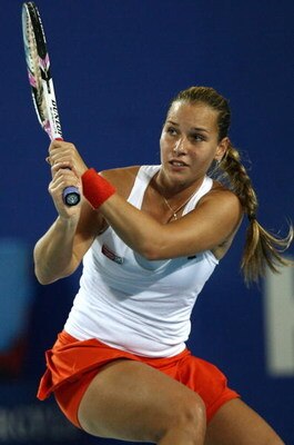 PERTH, AUSTRALIA - JANUARY 05:  Dominika Cibulkova of the Slovak Republic returns a shot to Meghann Shaughnessy of the USA during the womens singles match between the Slovak Republic and the USA during day three of the 2009 Hopman Cup at Burswood Dome on 