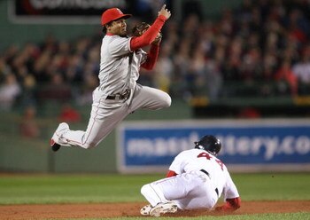 BOSTON - OCTOBER 06:  Jason Bay #44 of the Boston Red Sox is out at second as Erick Aybar #2 of the Los Angeles Angels of Anaheim sends the ball to first for the double play during Game Four of the American League Championship Series on October 6, 2008  a