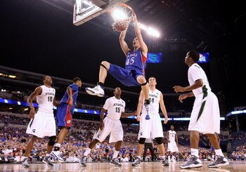 INDIANAPOLIS - MARCH 27:  Cole Aldrich #45 of the Kansas Jayhawks dunks against the Michigan State Spartans during the third round of the NCAA Division I Men's Basketball Tournament at the Lucas Oil Stadium on March 27, 2009 in Indianapolis, Indiana.  (Ph
