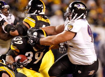 PITTSBURGH - JANUARY 18:  Nose tackel Haloti Ngata #92 of the Baltimore Ravens attempts to tackel Willie Parker #39 of the Pittsburgh Steelers during the AFC championship game on January 18, 2009 at Heinz Field in Pittsburgh, Pennsylvania.  (Photo by Greg