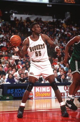 23 Feb 1994: DENVER CENTER DIKEMBE MUTOMBO LOOKS TO MAKE THE OUTLET PASS FOLLOWING THE REBOUND DURING THE NUGGETS GAME VERSUS THE BOSTON CELTICS.