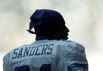 3 Oct 1999:  Deion Sanders #21 of the Dallas Cowboys looks on from the sidelines during the game against the Arizona Cardinals at the Texas Stadium in Dallas, Texas. The Cowboys defeated the Cardinals 35-7. Mandatory Credit: Matthew Stockman  /Allsport