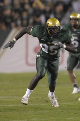 TAMPA, FL - NOVEMBER 17: Defensive end George Selvie #95 of the University of South Florida Bulls sets for play against the Louisville Cardinals at Raymond James Stadium on November 17, 2007 in Tampa, Florida.  South Florida won 55-17.  (Photo by Al Messe