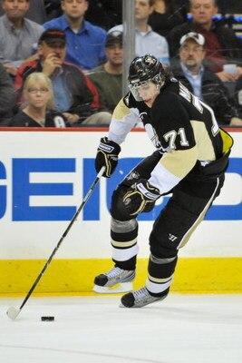 PITTSBURGH - MARCH 25:  Forward Evgeni Malkin #71 of the Pittsburgh Penguins skates with the puck against the Calgary Flames on March 25, 2009 at Mellon Arena in Pittsburgh, Pennsylvania.  (Photo by Jamie Sabau/Getty Images)