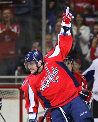 WASHINGTON - MARCH 27:  Alex Ovechkin #8 of the Washington Capitals celebrates his first period goal against the Tampa Bay Lightning on March 27, 2009 at the Verizon Center in Washington, D.C. The Capitals defeated the Lightning 5-3.  (Photo by Bruce Benn