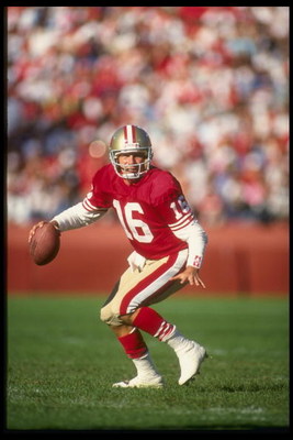 28 Oct 1990: Quarterback Joe Montana of the San Francisco 49ers looks down field for an open receiver as he drops back to pass during a play in the 49ers 20-17 victory over the Cleveland Browns at Candlestick Park in San Francisco, California.