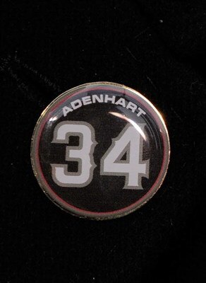 ANAHEIM, CA - APRIL 10:  A memorial pin with jersey number of pitcher Nick Adenhart of the Los Angeles Angels is seen on the jacket of his agent Scott Boras during the baseball game against the Boston Red Sox at Angel Stadium April 10, 2009 in Anaheim, Ca
