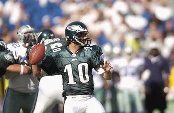 PHILADELPHIA - SEPTEMBER 22:  Quarteback Koy Detmer #10 of the Philadelphia Eagles looks to pass during the NFL game against the Dallas Cowboys on September 22, 2002 at Veterans Stadium in Philadelphia, Pennsylvania.  The Eagles won 44-13. (Photo by Ezra 