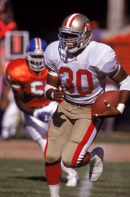 AUGUST 3:  Running back Keith Henderson #30 of the San Francisco 49ers finds room to run against the Denver Broncos during a preseason game on August 3, 1992.  The 49ers won 13-7.  (Photo by George Rose/Getty Images)