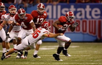 NEW ORLEANS - JANUARY 02:  Kick returner Javier Arenas #28 of the Alabama Crimson Tide runs the ball and scores a touchdown on a 73-yard punt return in the second quarter as Louie Sakoda #35 of the Utah Utes misses the tackle during the 75th Allstate Suga
